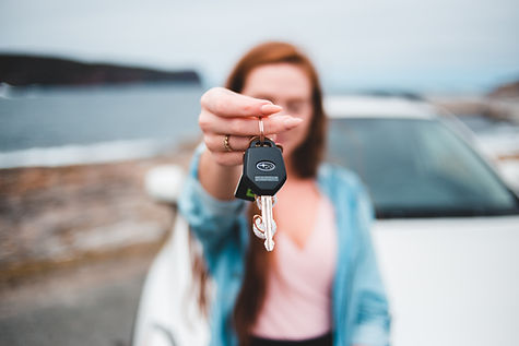 Woman Handing Over A Key
