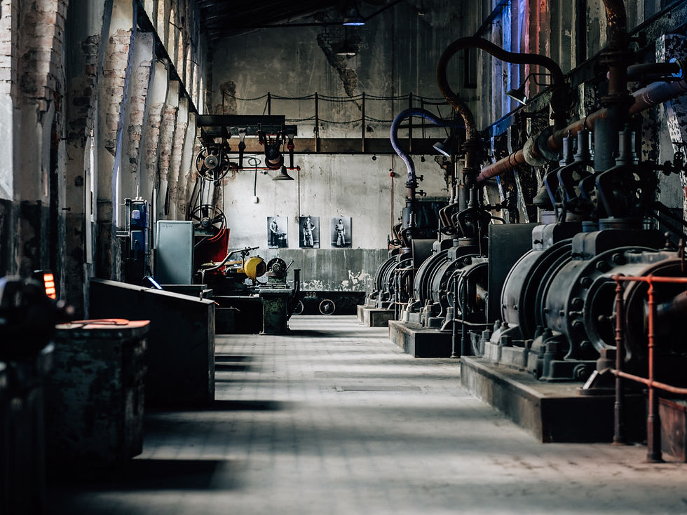 Row of motors and rotating equipment in an industrial machine hall