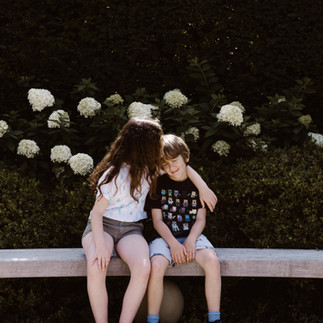 Sister and brother hugging