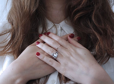 Girl with hands over heart