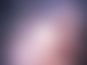 Bright burst of light with colorful rays extending outward on a dark background, creating a dynamic, radiant visual effect.
