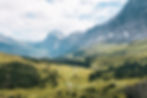 A view of a valley between snow capped mountains in Switzerland. 