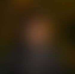 Man looking off to the side with a neutral, hard-to-read expression, representing emotional ambiguity