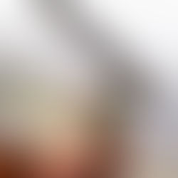 Brown wallet with Polish Zloty notes peeking out. Background has a pen and blurred handwritten text, creating a financial theme.