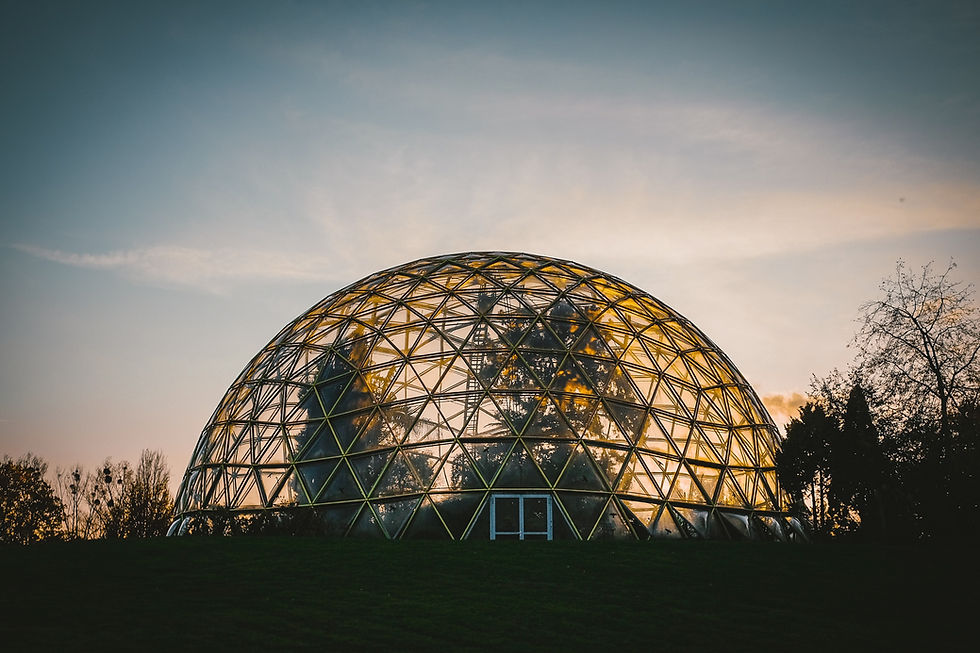 Glass dome greenhouse during sunrise