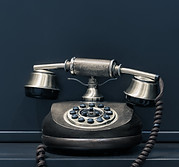 Black office telephone, symbolising direct contact with Rosi Legal for expert legal consultancy in London & Surrey.