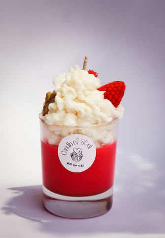 Red dessert candle with whipped wax and strawberry topping