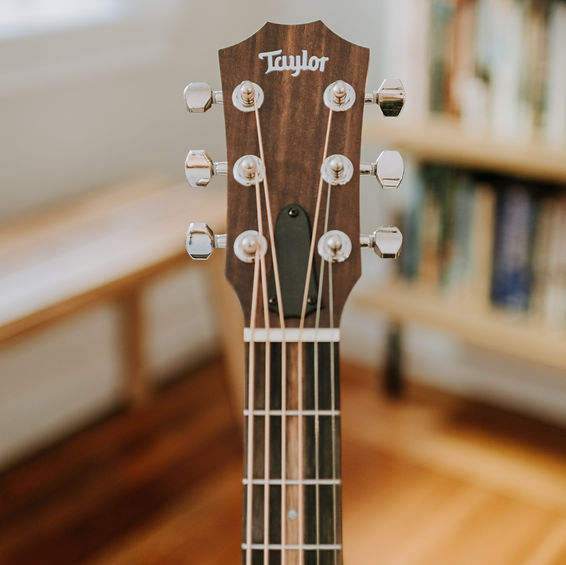 Taylor Guitar head representing Taylor Swift party