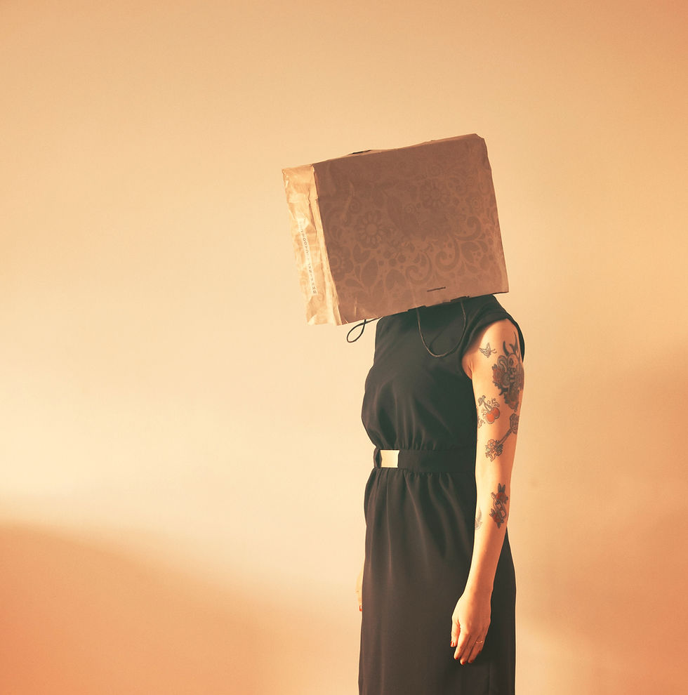 box on head, artistic photo, capitalism, reiki healing, decolonizing reiki healing, decolonizing experiences as a filipinx queer, tasha jade banate