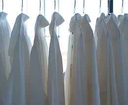 White uniforms on rack