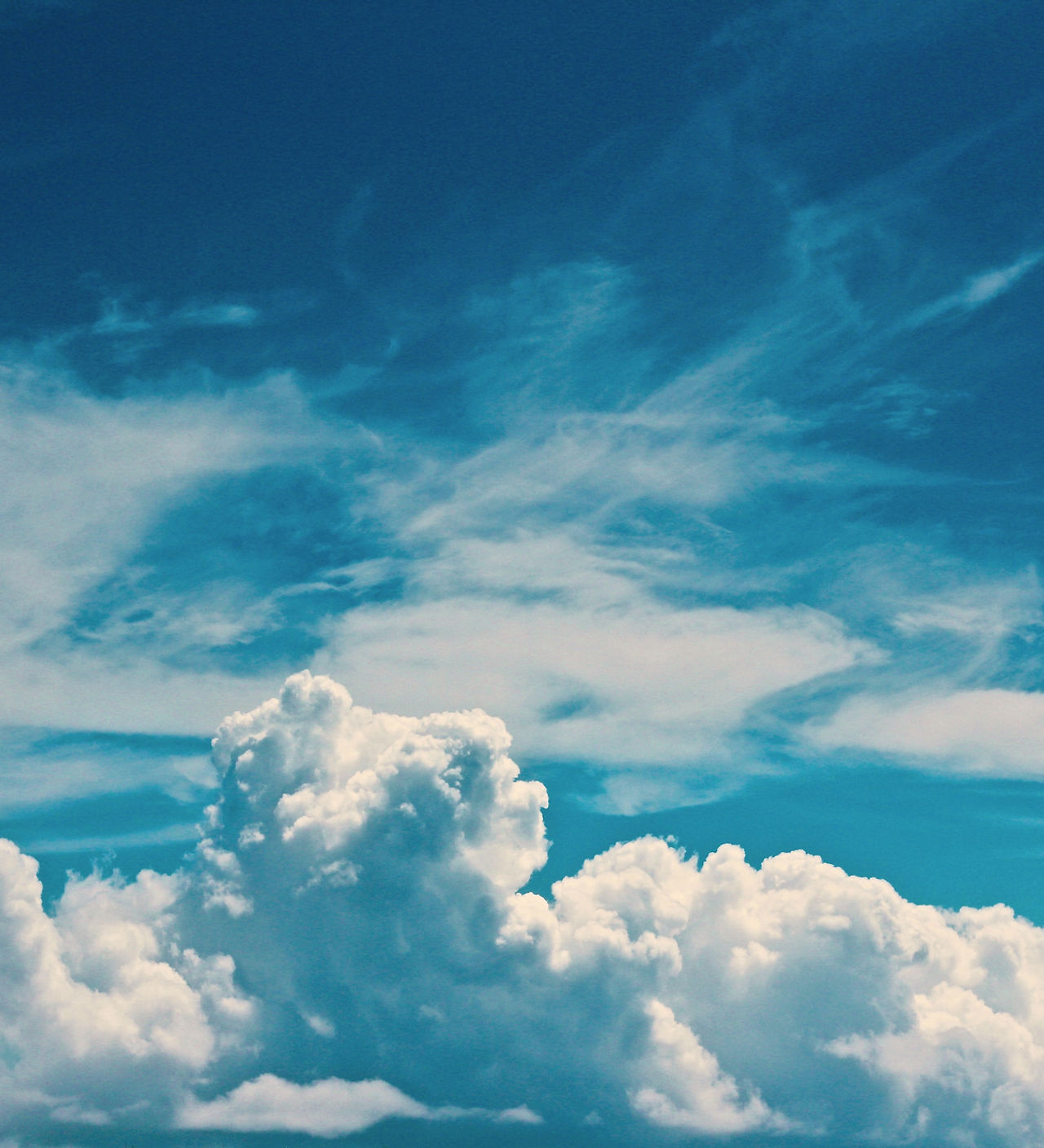 Blue sky with clouds that shows how safety with money can bring joy