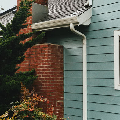 side of a house showing gutters.