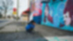 creatively gifted child taking a picture of mural