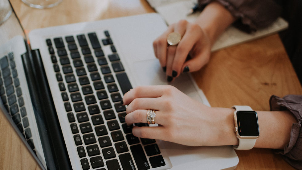 a woman typing on a keyboard