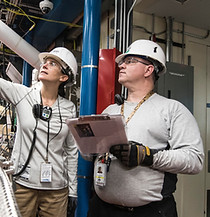 Technicians inspecting an industrial facility