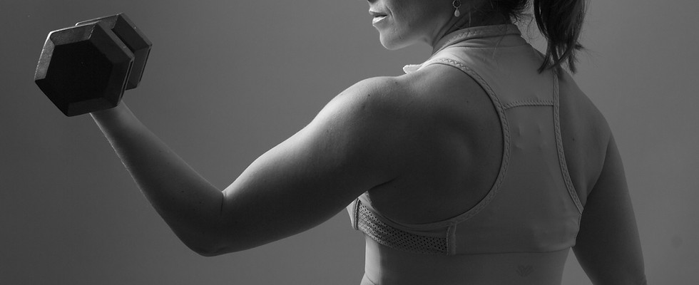 Woman bicep curl - Image by Limor Zellermayer