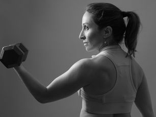 Woman lifting weights in midlife