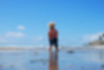 Kid standing on beach
