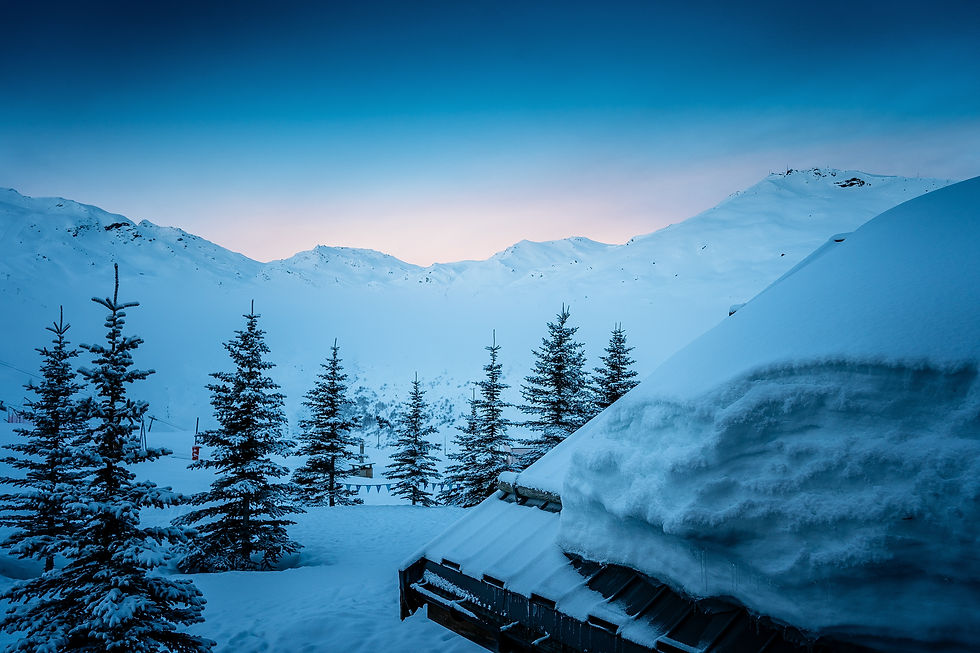 mountain home buried in snow