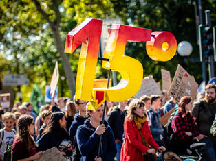 1.5 Celsius banner on a protest