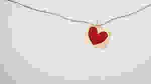 heart card clipped on a hanging string