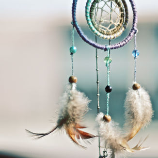 Dream Catcher displayed with 3 feathers with macramé circle