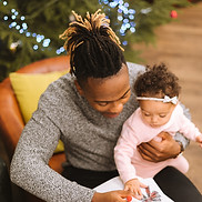 Caregiver and small child doing something together
