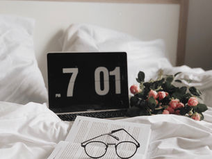 alarm clock on bed