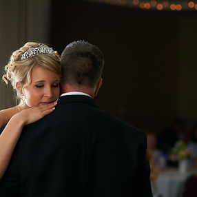 Father and daughter dancing to a custom song