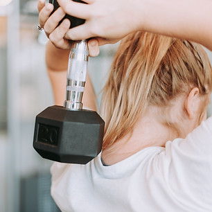 Girl lifting weights | ARC Performance Nutrition