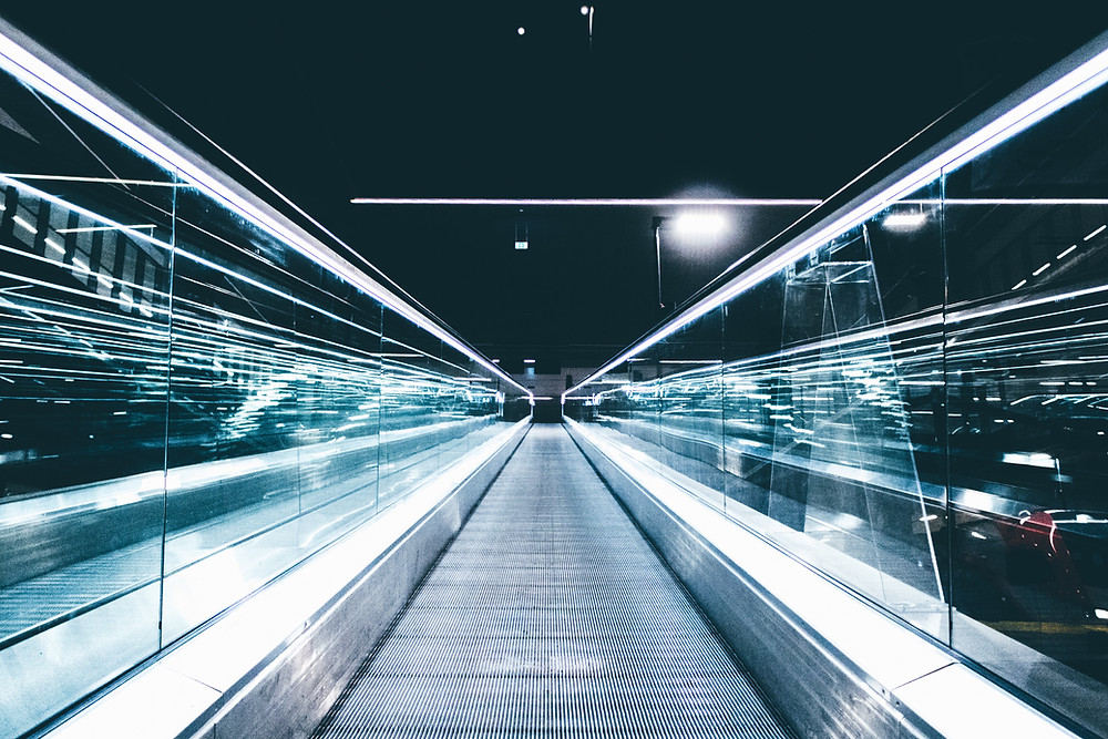 futurisitic white lit Moving walkway