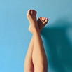 Waxed legs on blue background.