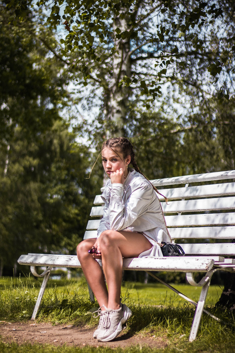 girl sat on park bench