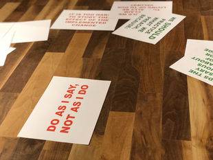A table with scrap of page do as i ask not as i do