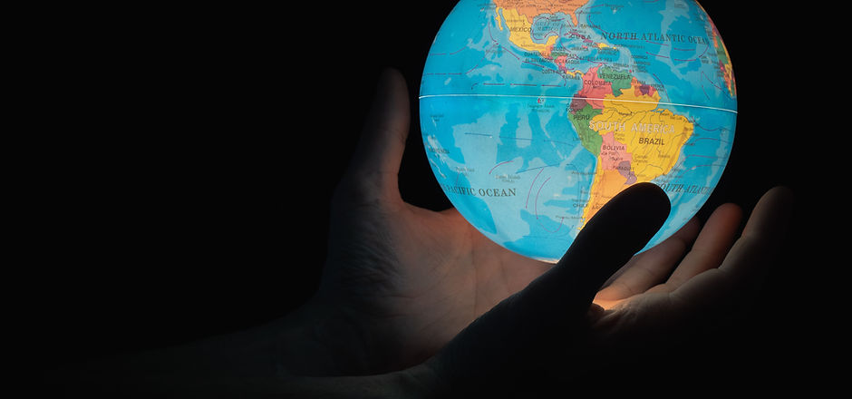 hands holding globe