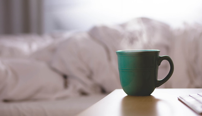 Hot beverage next to bed