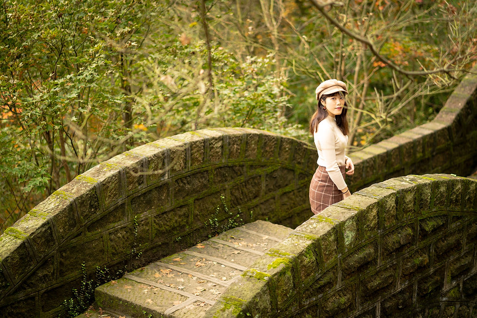 Woman on mossy bridge