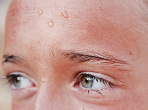 female sweating in sauna
