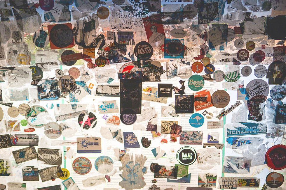 a white wall covered in stickers of many colors