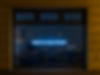 Window with neon sign saying "What is your story?" Image by Etienne Girardet