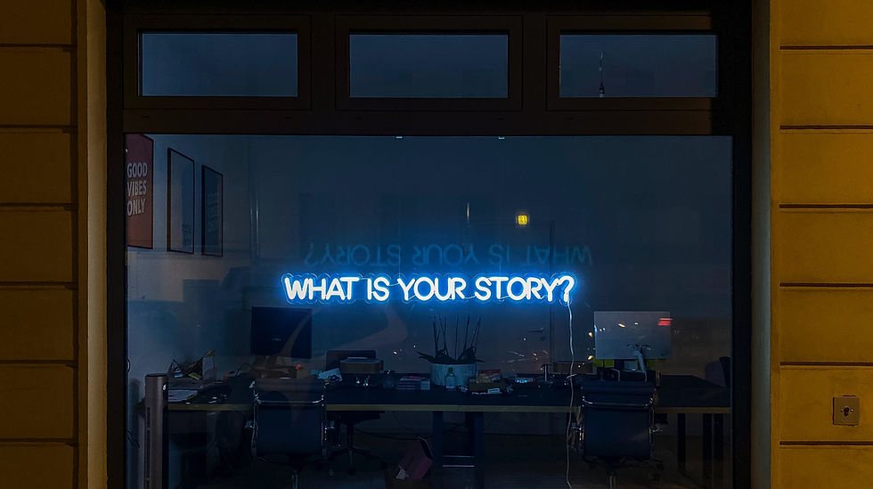 Dark office with screens and neon sign "What is your story?" – hero image for TechNovice guest author page