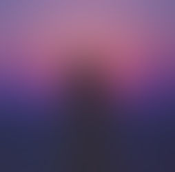 A lone silhouette stands against a mesmerizing sunset, her hair gently ruffled by the breeze, immersed in the tranquil hues of purple and pink.