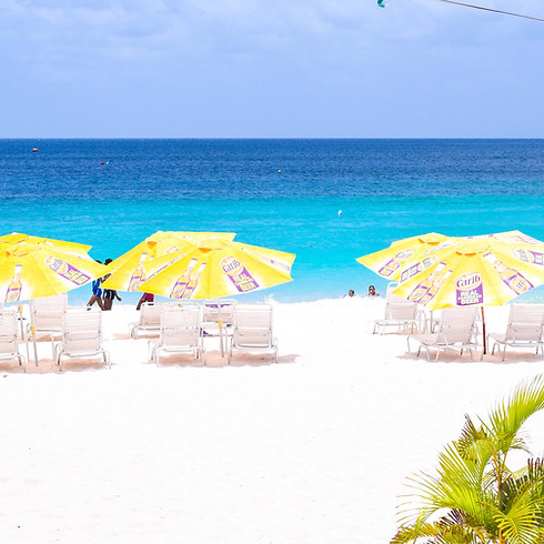 Beach with lounge chairs on the sand