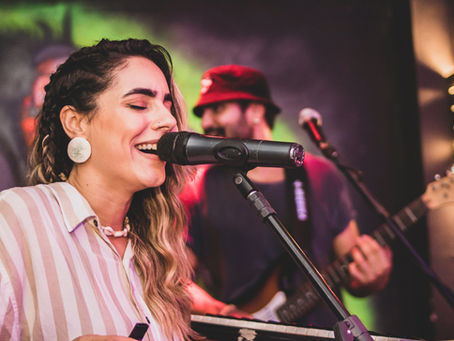 A Singer with her band performing at a live show