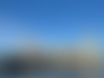 London bus driving over Westminster Bridge outside the Houses of Parliament in London