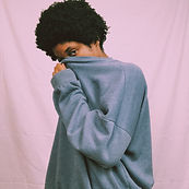 Woman covering her face, symbolizing the overwhelming impact of anxiety
