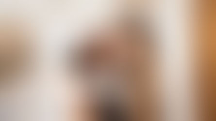 Woman kissing dog