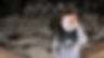 An individual wearing a mask, symbolizing identity theft and deception, as they attempt to steal personal information