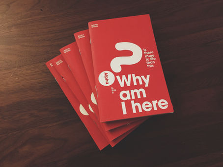 Red booklet with white print on cover featuring a large question mark and in large letters, "Why am I here"