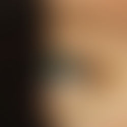 A close-up of an eye partially covered in shadow, highlighting intricate details and subtle contrasts.